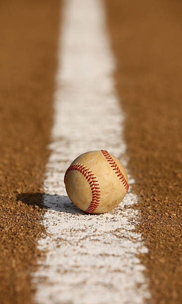 istock Worn Baseball on the Infield Chalk Line 480318924