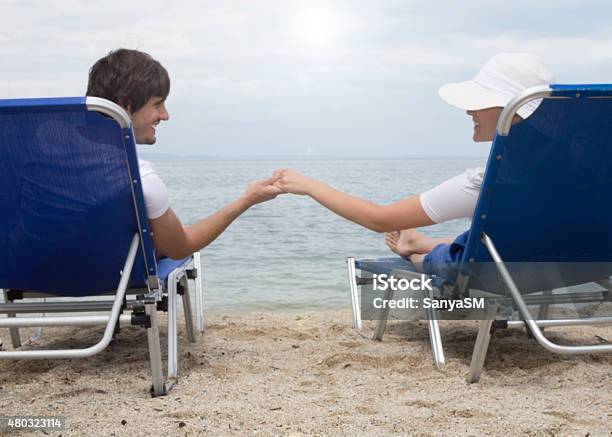 Couple On A Beach Stock Photo - Download Image Now - 2015, Adult, Adults Only