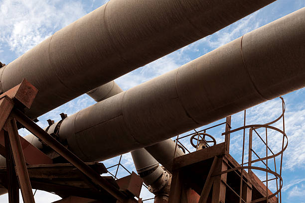 istock Dark industrial pipeline fragment with blue sky 480327003