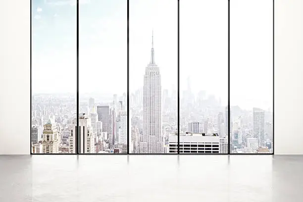 Photo of Blank white room with city view