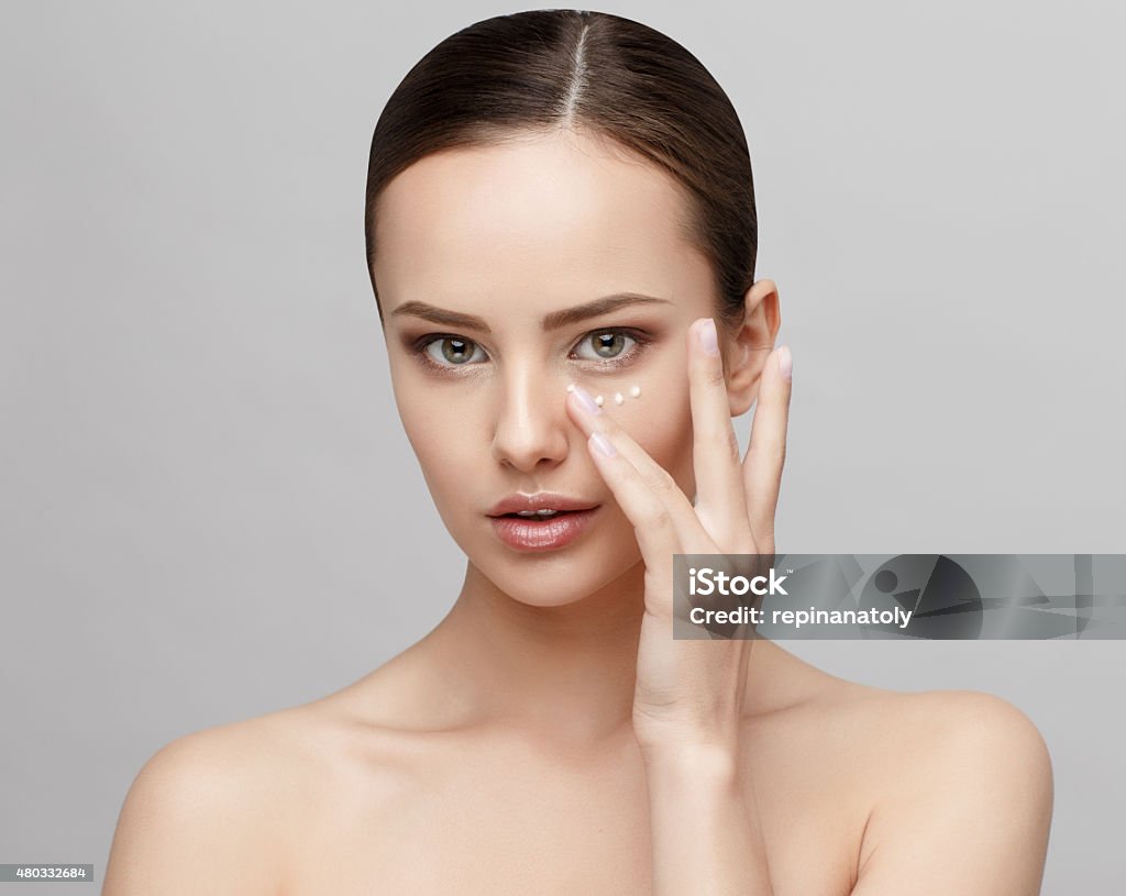Beautiful Woman with Clean Fresh Skin Beautiful Face of Young Woman with Clean Fresh Skin close up isolated on white. Beauty Portrait. Beautiful Spa Woman Smiling. Perfect Fresh Skin. Pure Beauty Model. Youth and Skin Care Concept 2015 Stock Photo