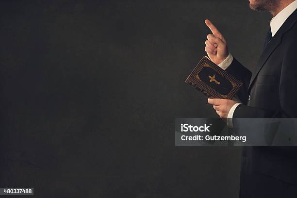 Man With A Bible And A Wagging Finger Stock Photo - Download Image Now - Preacher, Bible, Finger Wagging