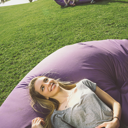 Young beautiful woman relaxing at the park.