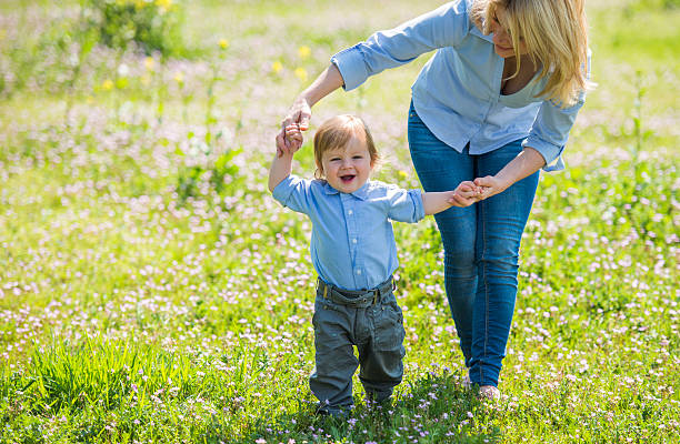 istock Baby boy's first steps in nature. 480338738