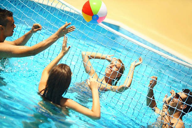istock Friends playing volleyball in a pool. 480338914