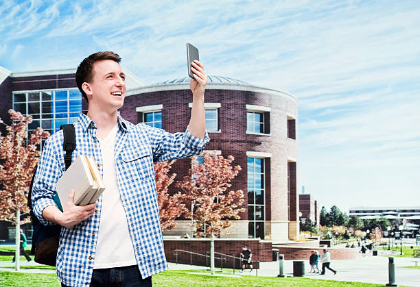 istock Smiling male student taking a selfie outdoors 480339022