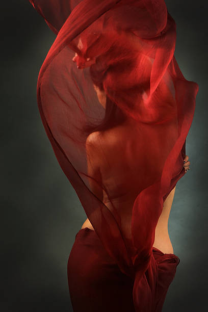 istock girl with red silk cloth 480341976
