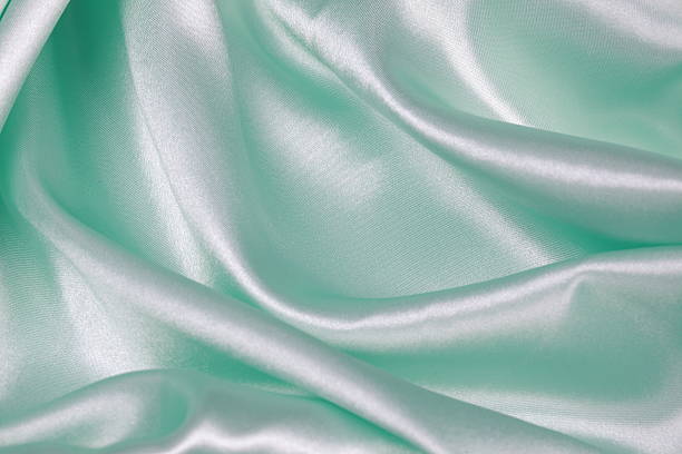 istock Light green Silk cloth of wavy abstract background 480344656