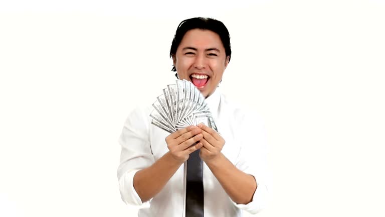 Man waving 100 dollar bills in front of him