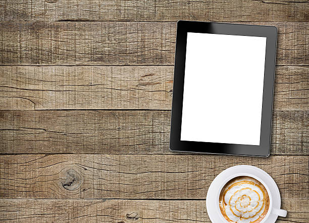istock tablet white screen display and coffee on old wood background 480347944