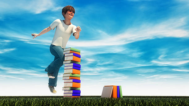 istock Young boy jumping on the grass with books 480348766