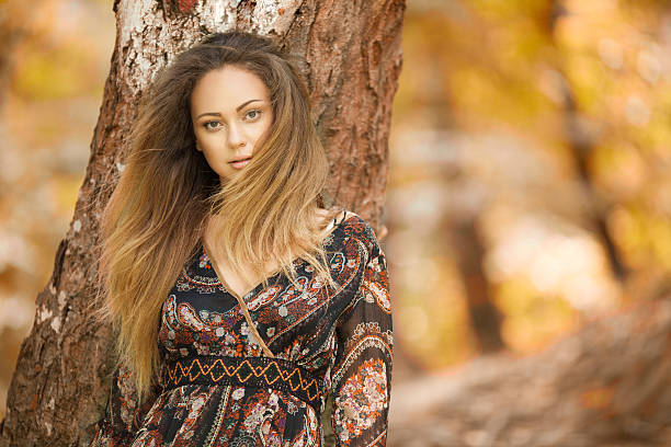 istock Fashion model posing in forest at autumn 480350916