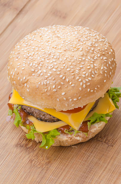 istock Tasty cheeseburger with lettuce, beef, double cheese and ketchup 480353756