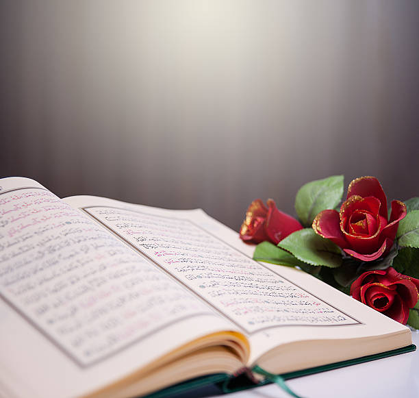 istock Holy Quran and roses 480355199