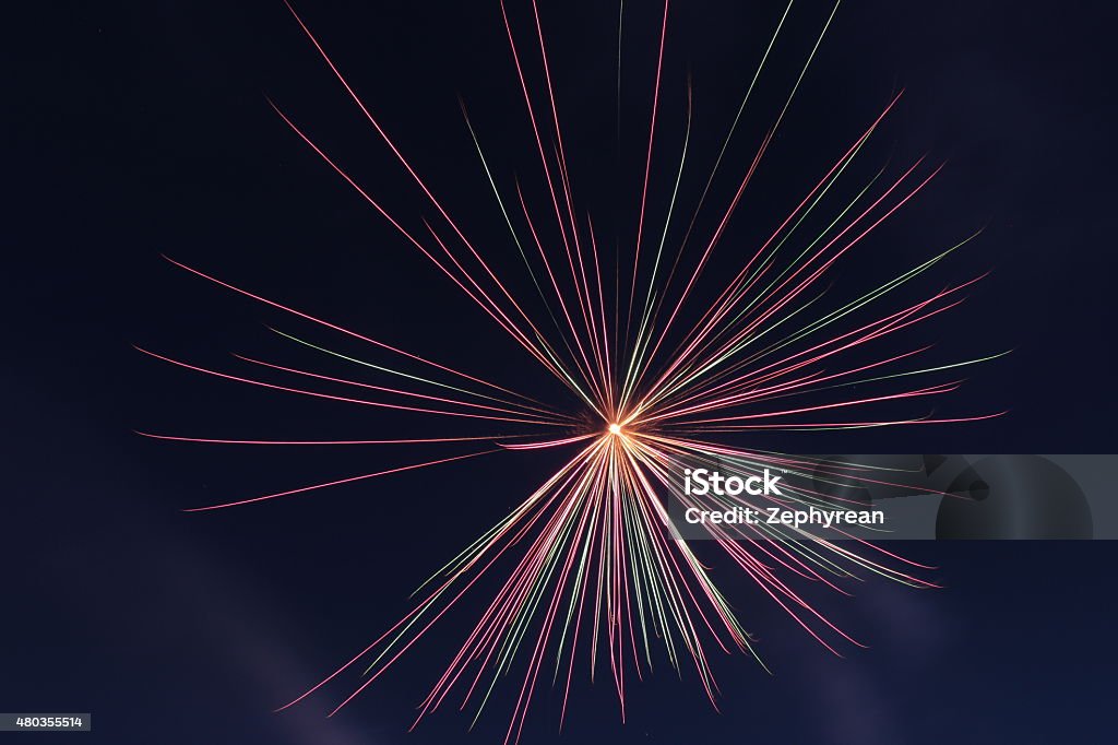 Fireworks: Red-Green Burst Fireworks display, single mortar, red & green burst. 2015 Stock Photo