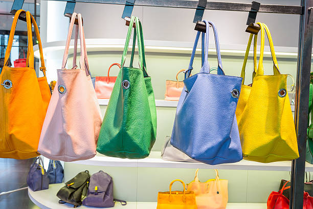 istock female bags in shop display window 480357620