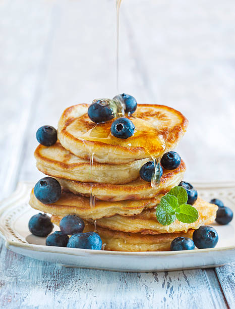 istock Stack of pancakes with fresh blueberry and honey 480357836