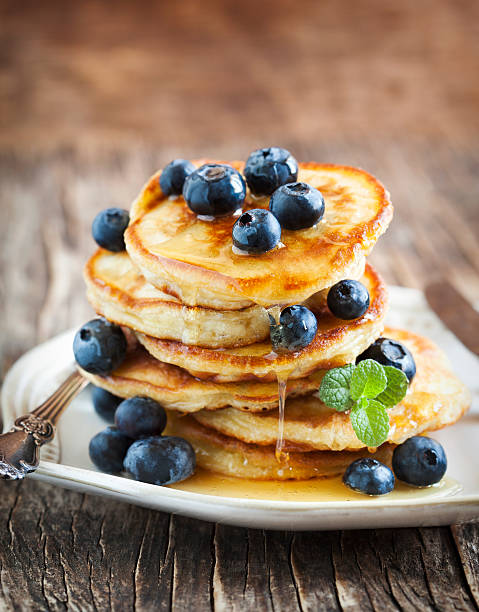 istock Stack of pancakes with fresh blueberry and honey 480357842