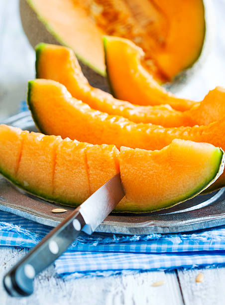 istock Cantaloupe melon slices on metal rustic plate 480357854
