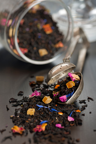 Tea strainer with leaves of herbal tea