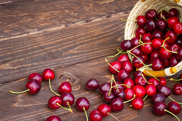 Sweet cherries on wooden background stock photo