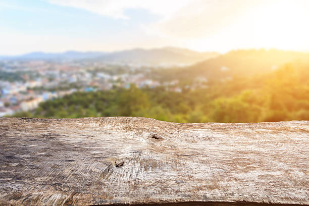 istock Old wood table top with sunlight and blur background 480368880