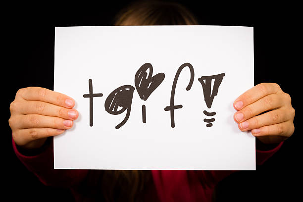 istock Child holding TGIF sign 480370664