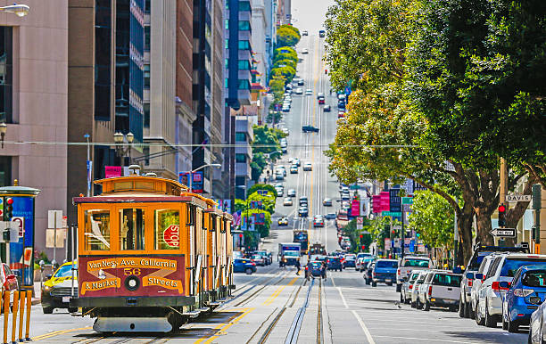 The historic cable car on San francisco city San Francisco County, Cable Car, California Street, Overhead Cable Car san francisco california street stock pictures, royalty-free photos & images