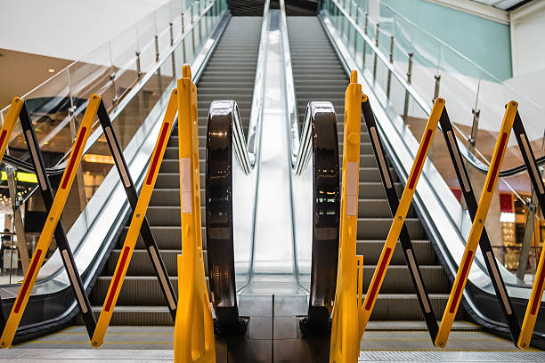 istock out of service escalator in an office 480374917