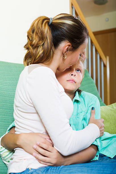 istock middle-aged woman comforting crying son 480375192