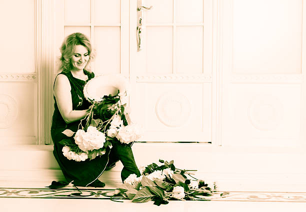 The woman scattered flowers from the vase