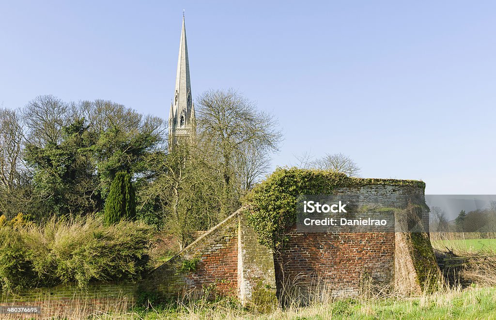 St Mary's Church, South Dalton, Yorkshire, UK. St Mary's church, circa 1859, on a bright winter's morning and also an old brick perimeter wall  in the village of South Dalton, near Beverley, Yorkshire, UK. Ancient Stock Photo