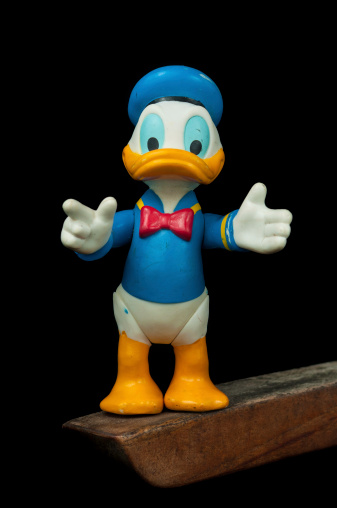 Lahti, Finland - June 15, 2013: Donald Duck standing on wooden piece