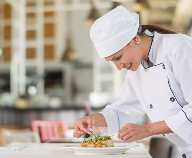 istock Female chef cooking at a restaurant 480379706