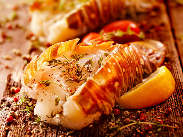 Lobster Tails Seasoned for the Grill Raw Lobster Tails Seasoned for the Grill -Photographed on Hasselblad H3D2-39mb Camera tail fin photos stock pictures, royalty-free photos & images