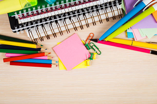 istock School and office accessories on wooden background 480381578