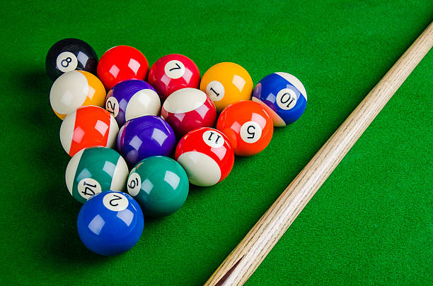 istock Billiard balls on green table with billiard cue. 480384122