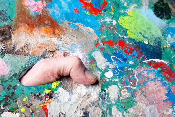 istock colorful palette and paint brushes 480386025