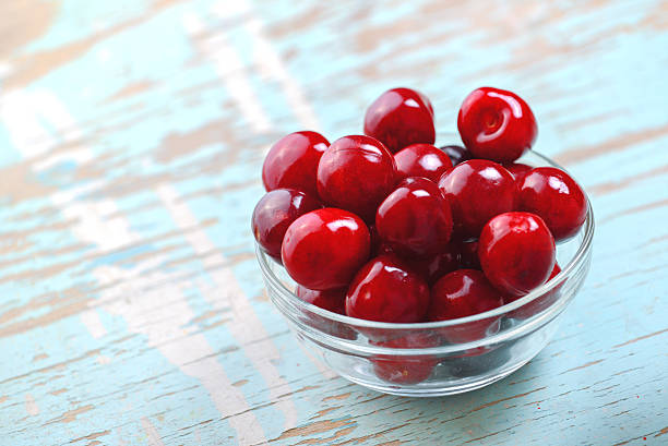 istock Sweet Cherry in Glass Bowl on Rustic Table 480386786