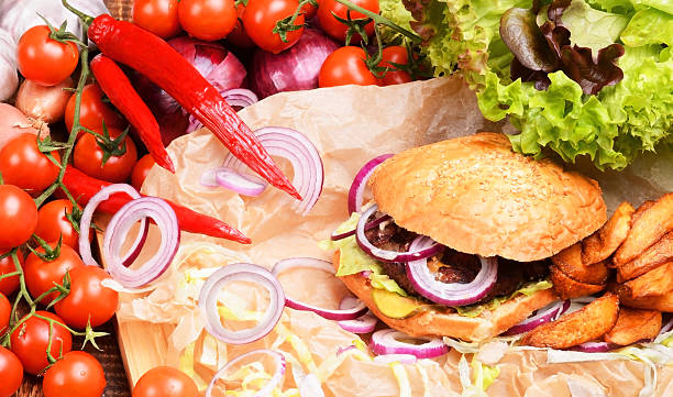 istock Delicious homemade burger with fresh vegetables and beef. 480386898
