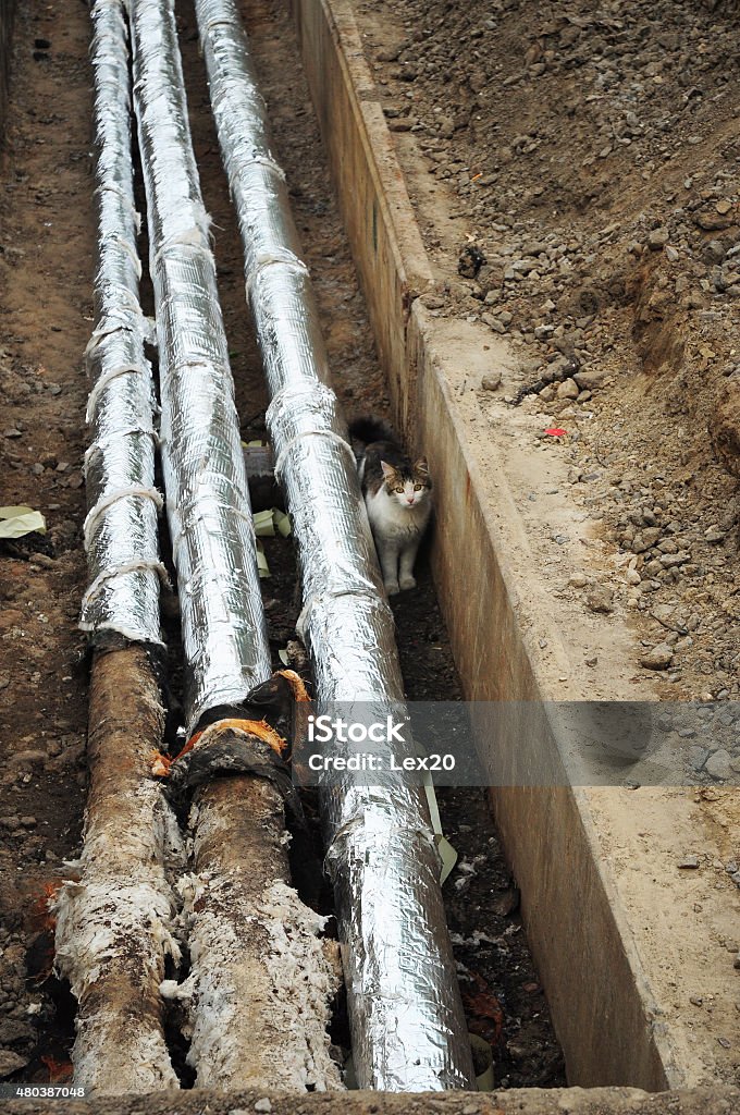 Repair, insulation and replacement of sewer. Breakthrough sewerage system.Pipes for water in an earthen trench. 2015 Stock Photo