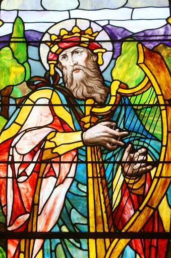 Stained glass window depicting Jesus Christ, Moses with the Ten Commandments and the Prophet Iesaiah, in the cathedral of Schwerin, Germany