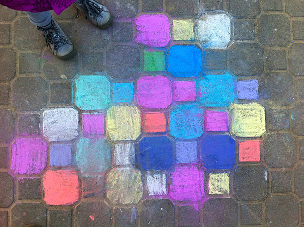 istock child chalk painting on the pavement 480387673