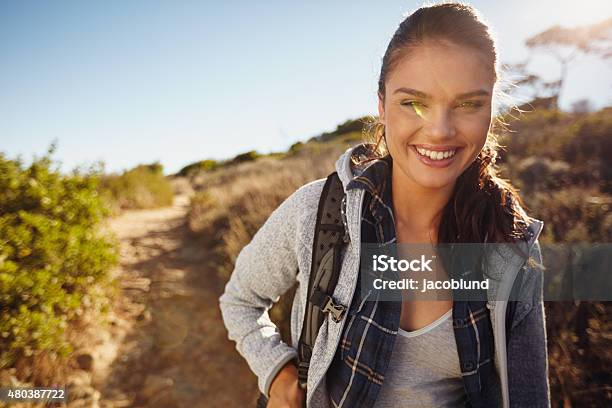 Young Female Tourist Hiking In Nature Stock Photo - Download Image Now - 20-29 Years, 2015, Active Lifestyle