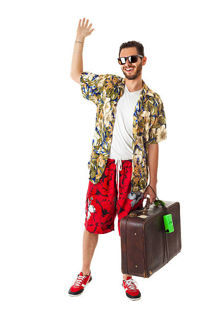 手を振るハッピーな観光 - travel suitcase hawaiian shirt people traveling ストックフォトと画像