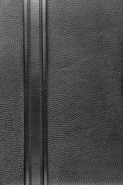 istock Black belt lies on the natural leather 480389505