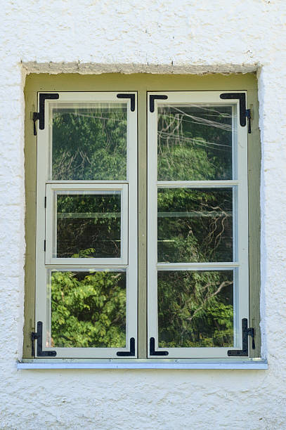 istock Wooden rural window with tree reflection on mirror 480390386