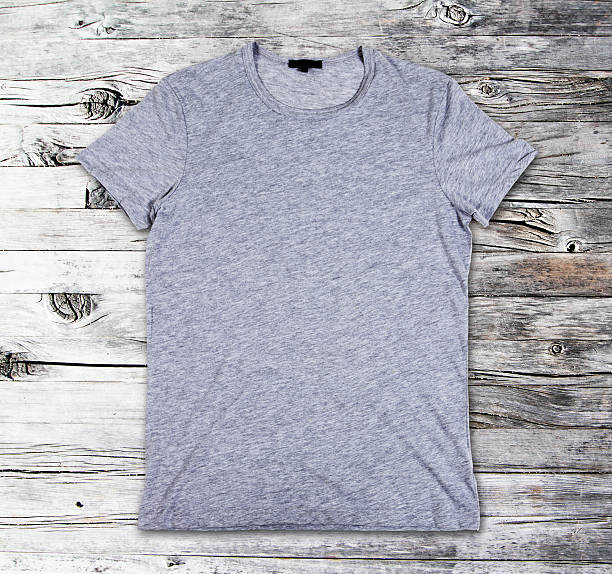 istock Blank t-shirts on a wooden surface 480390552