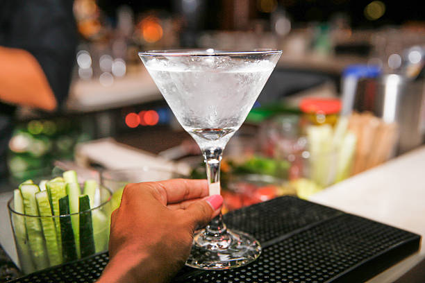 istock Close up woman hands holding cocktail 480391304