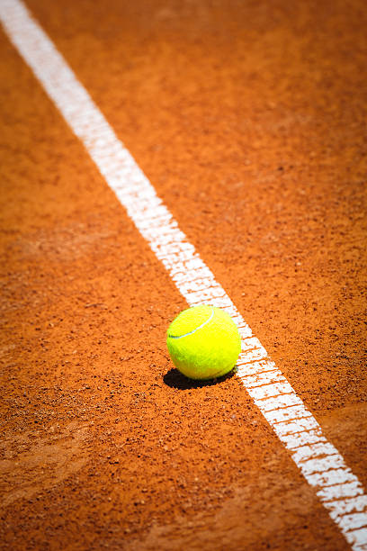 istock Tennis ball on clay court 480391414